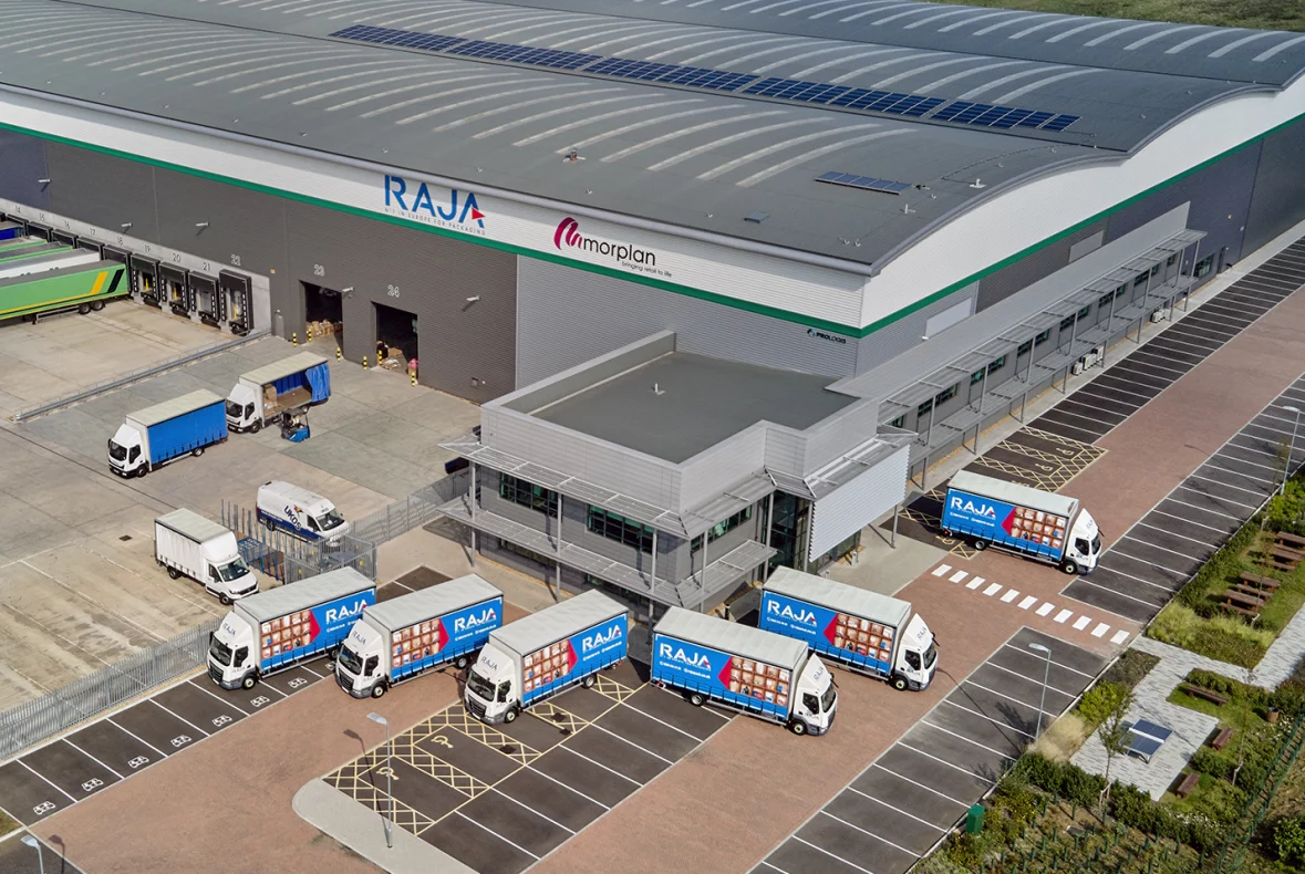 Aerial Shot of RAJA Trucks Outside Warehouse Building