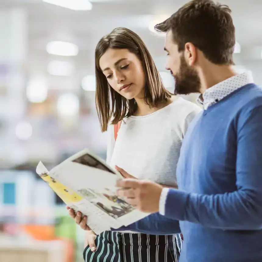 Designers reviewing a brochure